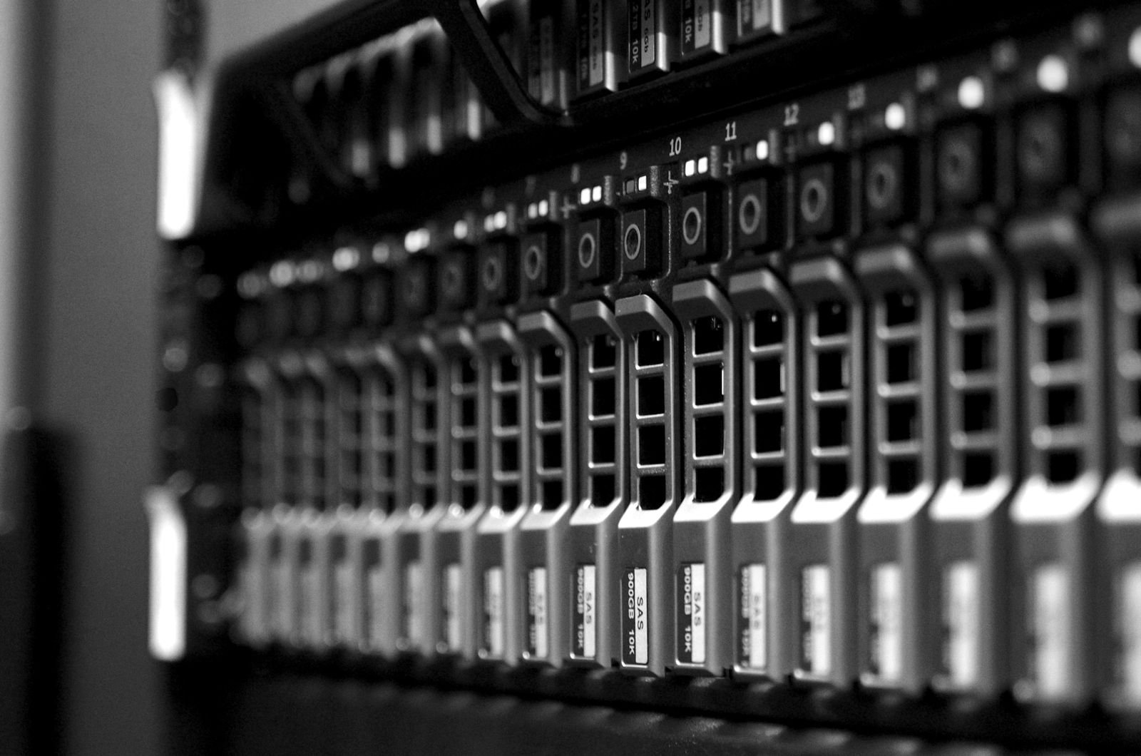 A row of servers in a rack with status lights on