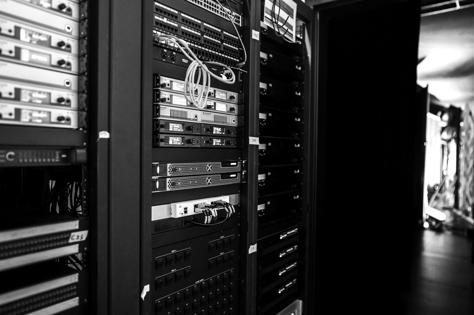An open network rack with patch cables and equipment